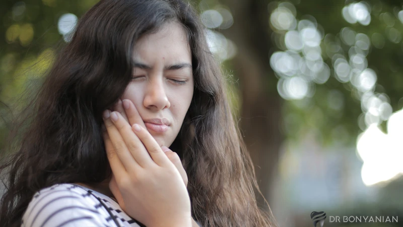 Cause of tooth pain a few months after a root canal